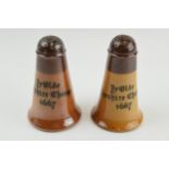 A near pair of Doulton Lambeth 'Ye Olde Cheshire Cheese 1667' pepperettes, 11cm tall (2). In good