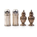 Two pairs of silver cruet sets, one set with ornate decoration, the others of plainer form, 95.6