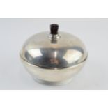 Silver powder puff of domed form, with bakelite interior and handle, Birmingham 1932, gross weight