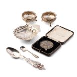 A collection of sterling silver items to include a pair of Chester salts, a spoon with enamalled