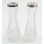 Silver pair of glass vases with silver rims, Birmingham 1906 (2), 11cm tall. Rims bent / minor