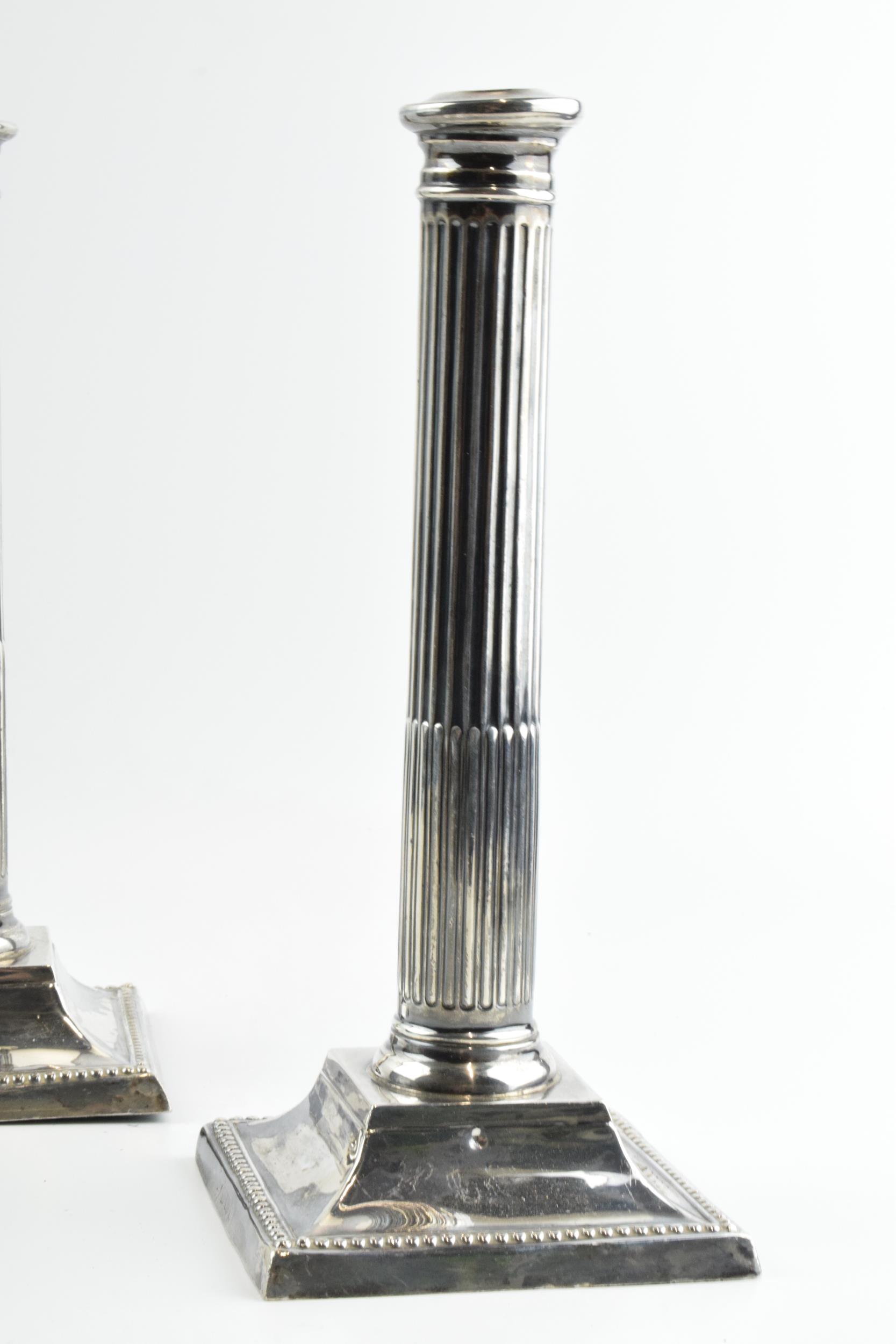A pair of 26cm tall silver Corinthian column candlesticks, Birmingham 1908, with loaded bases, gross - Image 3 of 6