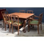Reproduction Regency style extendable dining table with 6 chairs to include 2 chairs, with sliding