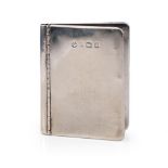 Hallmarked silver novelty photo frame in the form of a book, 63 grams, Birmingham 1902, 6cm tall.