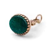 9ct gold ornate fob set with green hardstone, gross weight 3.5 grams, 26mm tall.