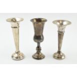 A trio of singular silver vases to include a pedestal vase and trumpet vases (loaded bases), gross
