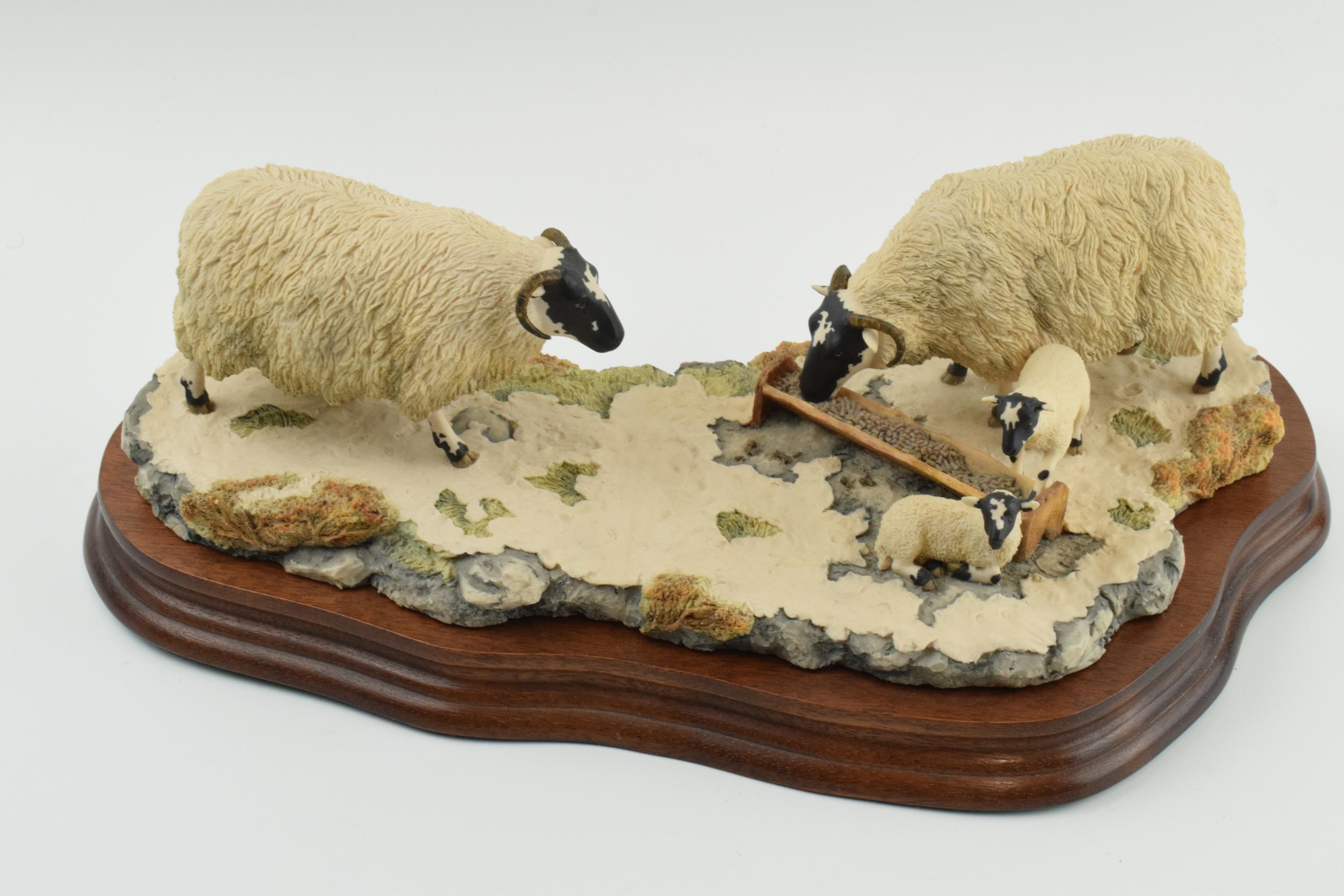 Border Fine Arts figure group 'Early Lambs Late Snow' by Ray Ayres, 35cm long, wooden base. In