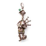 Sterling silver figure / charm of a Scottish Bagpipe player with enamelled decoration, 31.0 grams,
