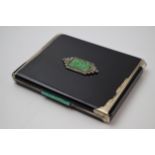 Asprey & Co: a silver gilt cigarette case with enamelled decoration set with Jade inserts, 8.5cm