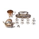A collection of silver items to include a nail buffer, a modernist style cup, a set of 4 loaded