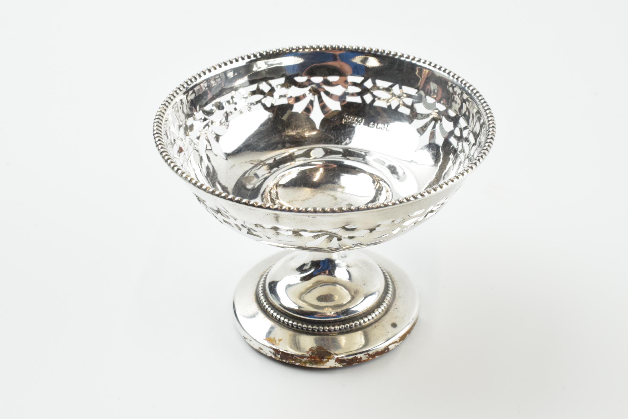 A pair of silver items to include an ornate pedestal sweet dish, Birmingham 1922, loaded base, and a - Image 5 of 8