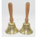 A pair of vintage wooden and brass hand bells (2), 20cm tall.