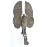 A car mascot in the form of a stylised bird with snake wrapped around its legs. 18cm x 9.5cm. In