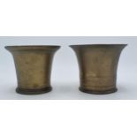 A near pair of phosphor bronze mortars. Height 10cm. Generally in good order with some age related