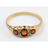 9ct gold ring set with garnets and diamonds, 1.8 grams, size T.