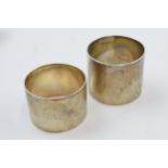 A pair of wide napkin rings, Birm 1904 and London 1913 (monogrammed), 79.8 grams (2).