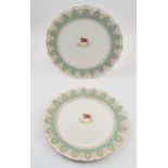 A pair of White Star Line first class plates. Centres painted with logo. Boarders decorated with