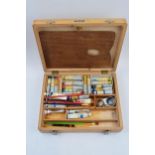 Vintage wooden cased Reeves travelling paint box, colour pallet and paints with a selection of