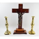 A large wooden and metal religious church crucifix together with an ecclesiastical style pair of