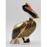 Royal Crown Derby paperweight. Brown Pelican with gold stopper. Height 13cm. In good condition.