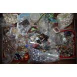 A large collection of costume jewellery beads, costume jewellery and accessories of varying forms,