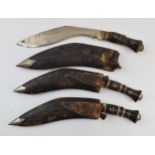 A trio of vintage Gurkha Kukri knifes with leather scabbards, longest 42cm (3).