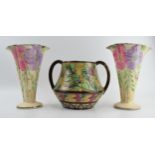 A pair of Arthur Woods floral shaped trumpet vases and a large two handled floral vase, believed
