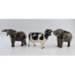 A pair of Beswick elephants (1 nip to tusk) and a Friesian cow (1 horn af) (3). One elephant is in