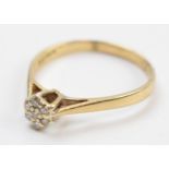 9ct gold ring set with 7 illusion set diamonds, 2.0 grams, size V.