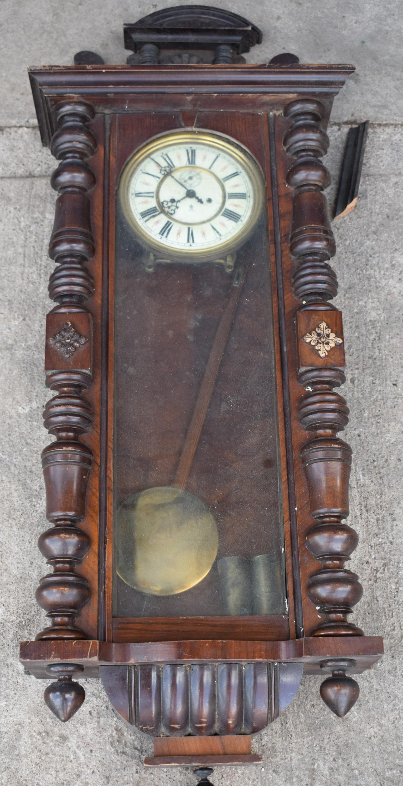 Late 19th century Gustav Becker mahogany Vienna wall clock with weights and pendulum, 110cm long,