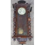 Late 19th century Gustav Becker mahogany Vienna wall clock with weights and pendulum, 110cm long,