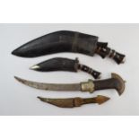 A collection of vintage blades to include a pair of Kukri knives and Eastern / African origin blades