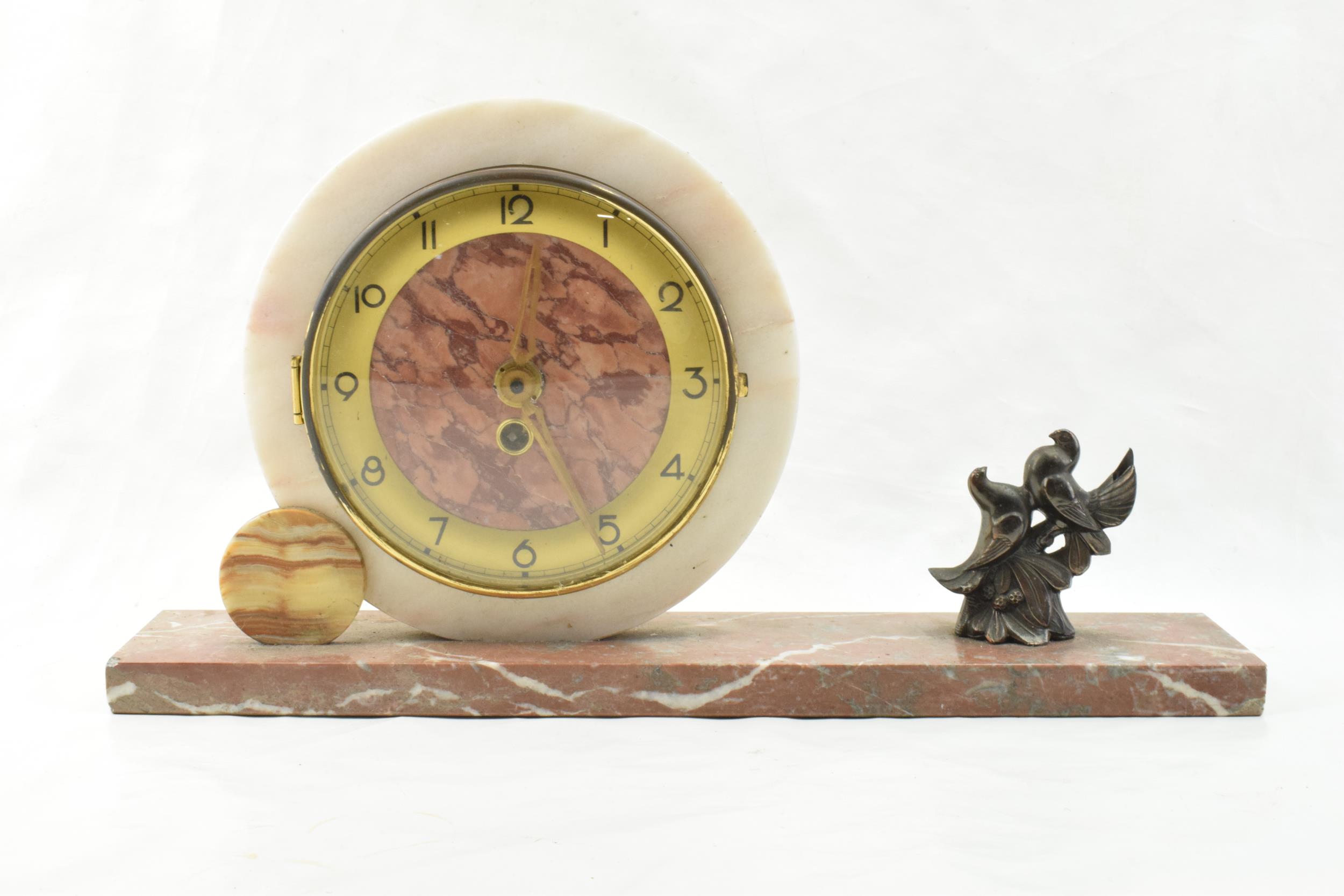 French Art Deco mantle clock with a pair of doves, 42cm long.