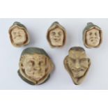 Unusual vintage cast plaster wall hanging busts in the form of beggars and evil looking character,