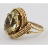 9ct gold chunky dress ring set with smoky stone, 9.4 grams gross weight, size Q.