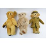 A collection of vintage teddy bears to include a Harrods bear, a Merrythought Barnados bear and a