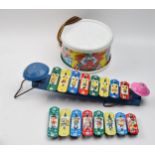 A trio of vintage childrens toys to include a pair of metal xylophones and a drum decorated with