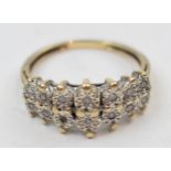 9ct gold diamond ring set with 14 illusion set diamonds, 2.8 grams, size N.