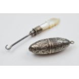 Miniature silver and Mother of Pearl button hook with white metal shaped needlecase with engraved
