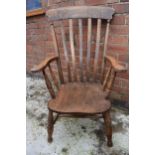 High backed country / farmhouse arm chair with shaped saddle seat, 106cm tall. In good condition