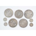 A collection of pre-1920 UK silver coins to include 5 Victorian crowns and three pence pieces, 143.8