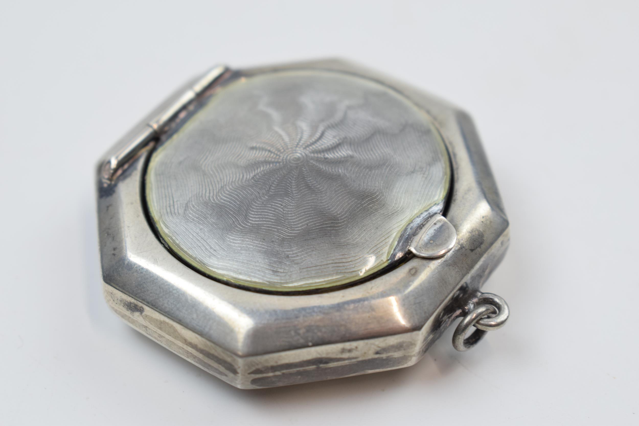 Silver rouge pot with guilloche enamelled decoration, mirror to interior, 4.5cm diameter.