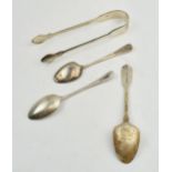 A collection of Sterling silver items to include sugar tongs and tea spoons. Of note Irish silver