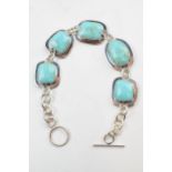 Silver ladies chunky bracelet set with turquoise style insets, 19cm long.