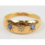Ladies 18ct gypsy ring with sapphires and diamond. Ring size P. Weight 4g. In good condition.