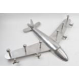 Vintage chrome style coat hanger in the form of an airplane, 65cm wide.