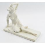 Art Deco figure, circa 1930s, of a lady sat wiping her brow, indistinct marks to base, perhaps reads
