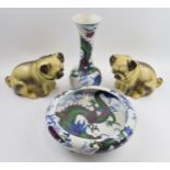 Pottery to include a Bursley Ware Dragon bowl raised on 4 feet, a matching tall vase with late