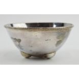 Unusual silver bowl with hammered design raised on 3 feet, 82.6 grams, 8cm diameter, London 1961,