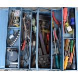 Vintage blue metal folding toolbox with contents of various tools and equipment.